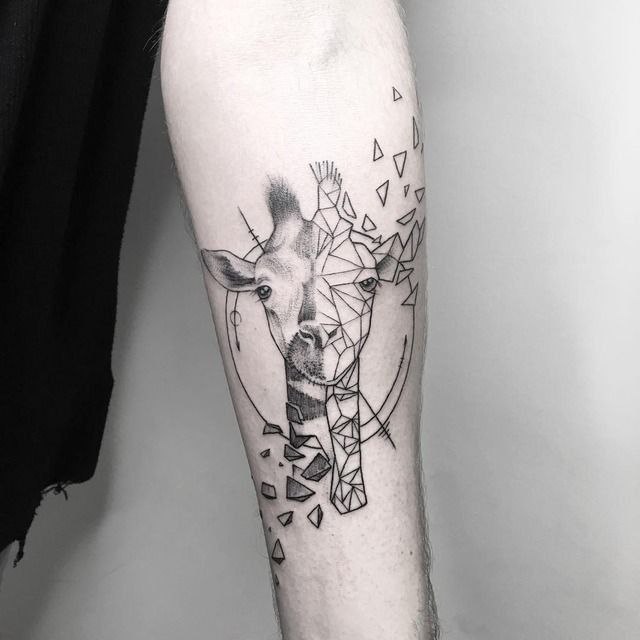 Tattoo of a giraffe on the forearm for women