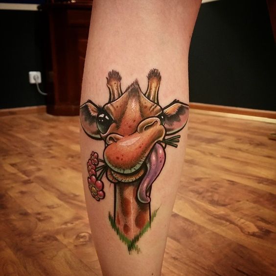 Color tattoo of a giraffe on a calf for women