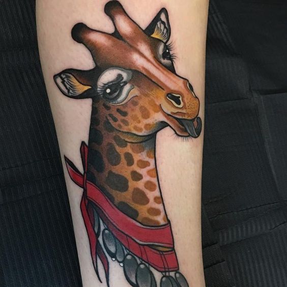 Color tattoo of a giraffe on the arm for women