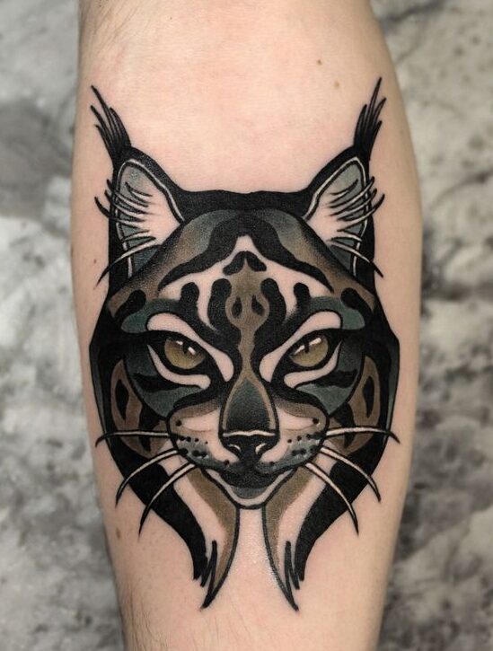 Tattoo of a lynx on the shin for men