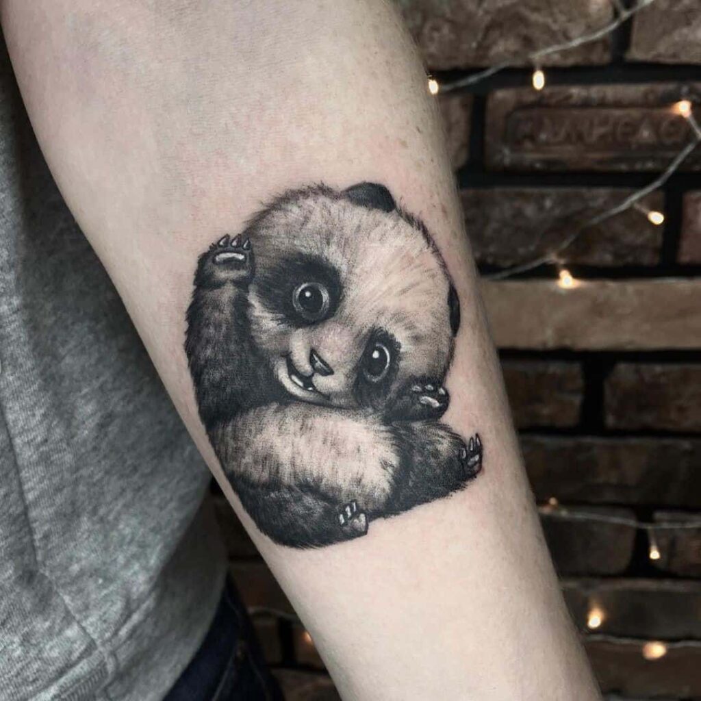 Panda tattoo on the forearm for men