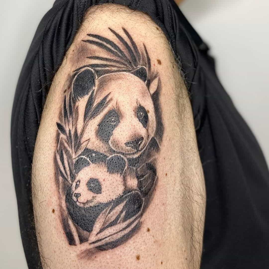 Tattoo of two pandas on the shoulder for men