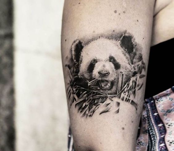 Panda tattoo on the shoulder for women