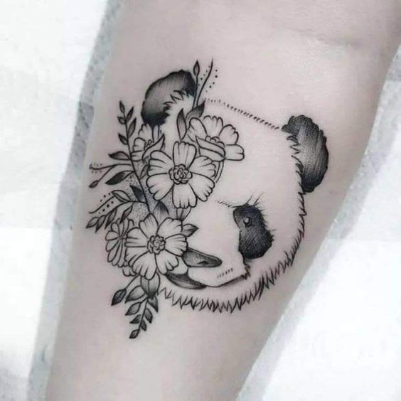 Panda and flower tattoo on the forearm for women