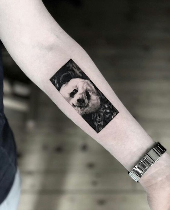 Panda tattoo on forearm for women