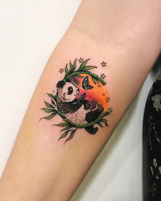 Colored panda tattoo on the forearm for women