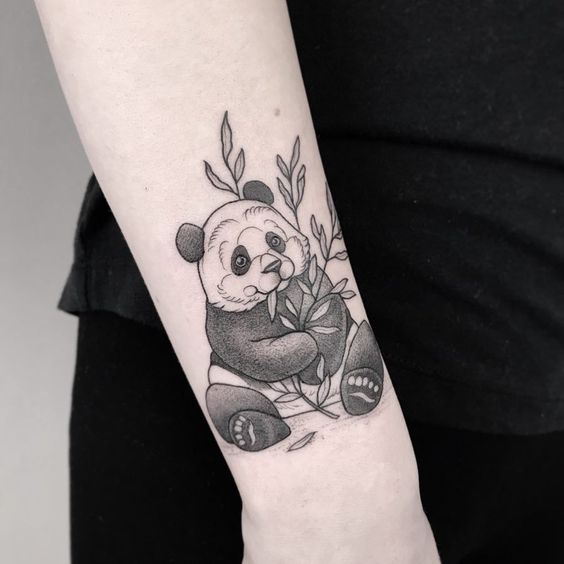 Panda tattoo on the forearm for women