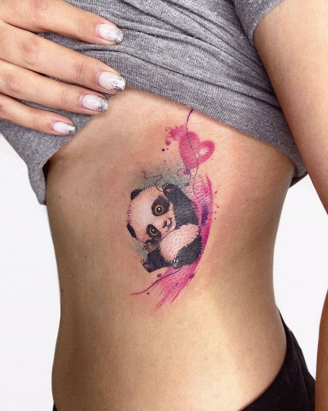 Colored panda tattoo on the side for women