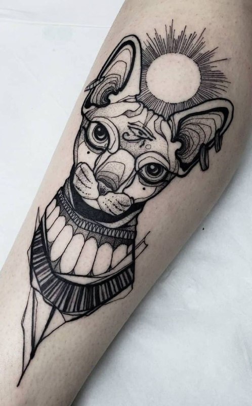 Tattoo of a sphinx on the shin for women