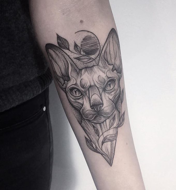 Tattoo of a sphinx on the forearm for women