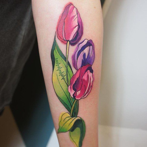 Color tattoo of a tulip on the forearm for men