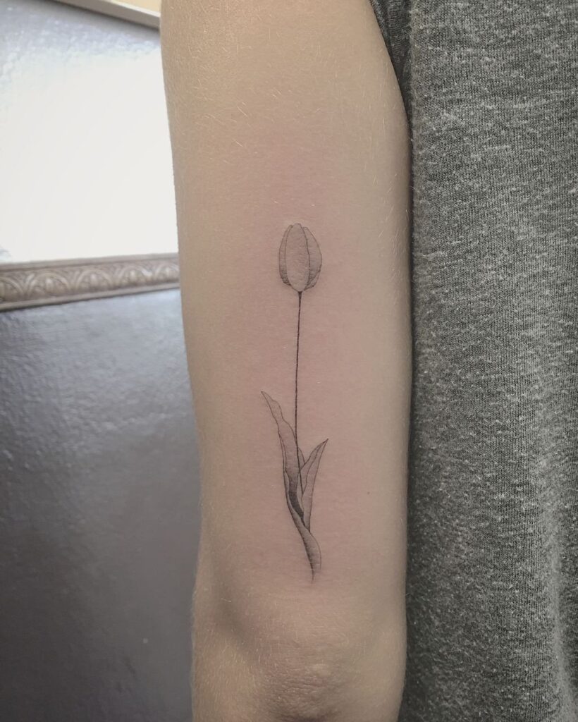 Tulip tattoo on the shoulder for women