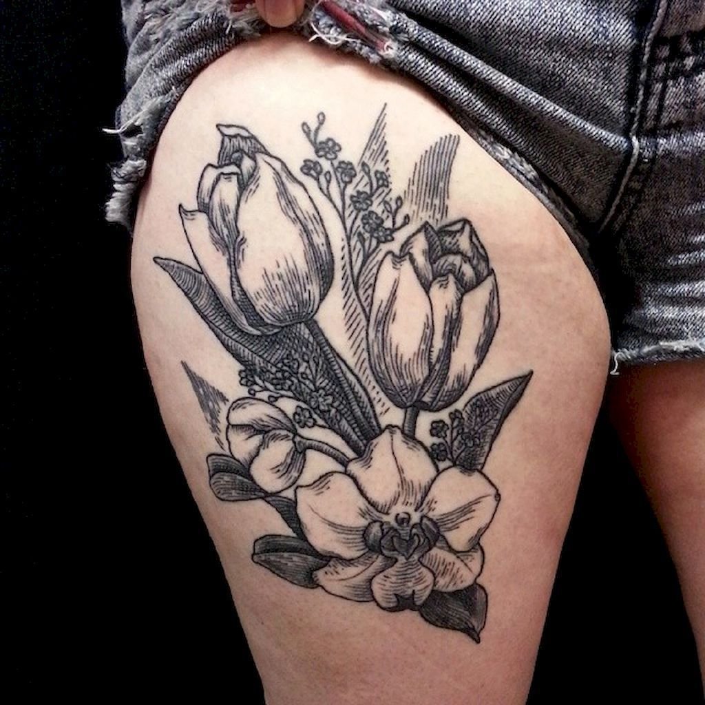 Large tulip tattoo on the hip for women