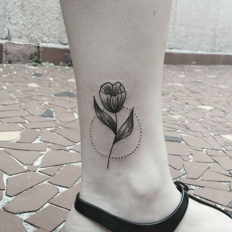 Tulip tattoo on the shin for women