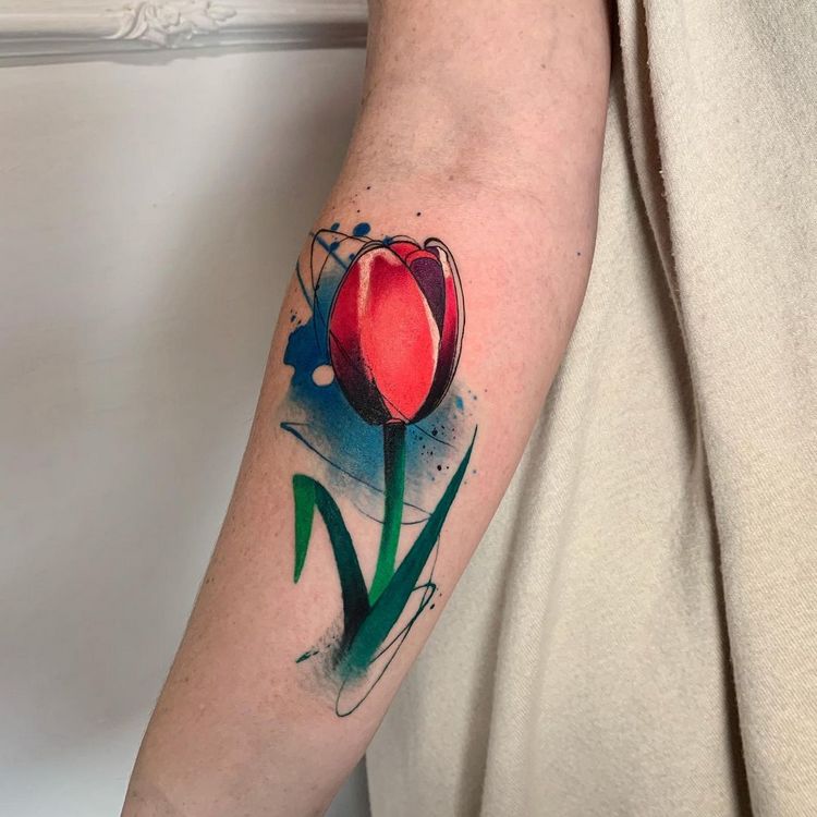 Color tattoo of a tulip on the forearm for women