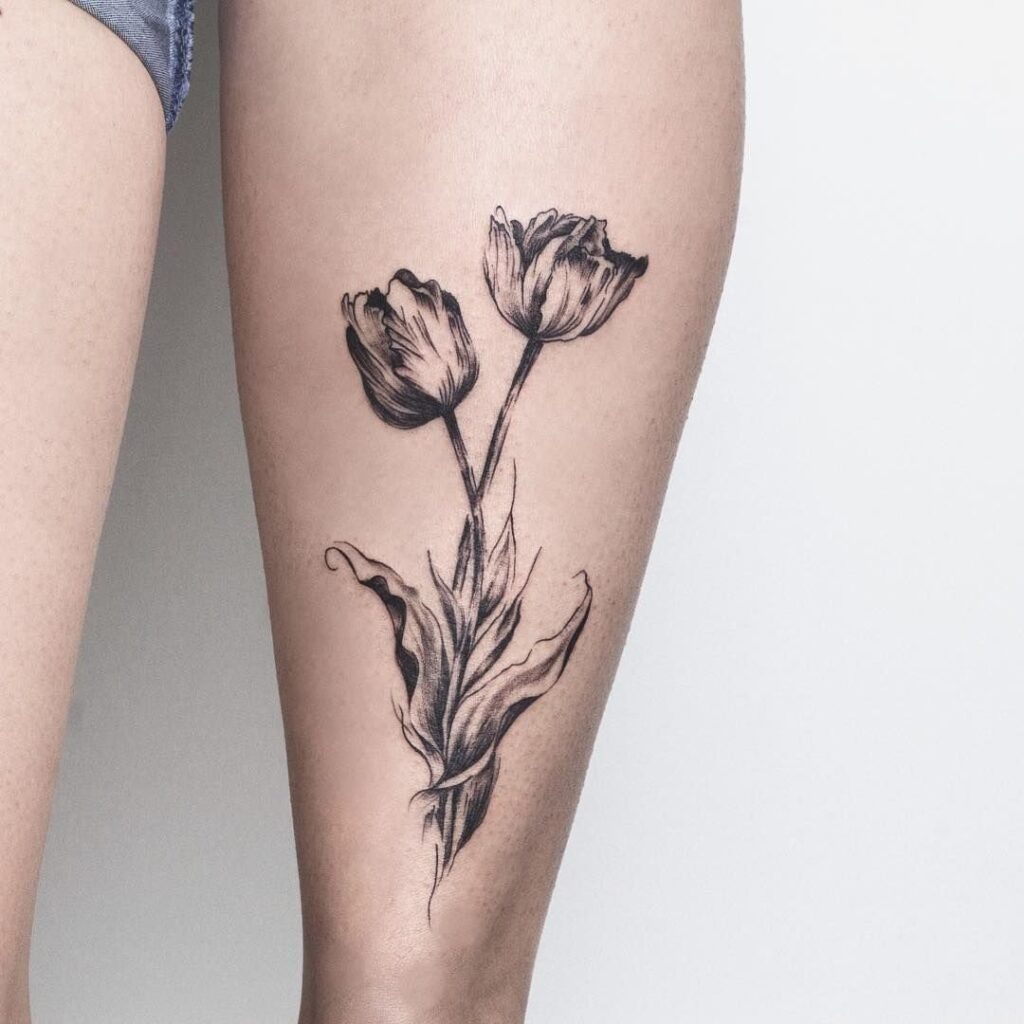 Tulip tattoo on the shin for women