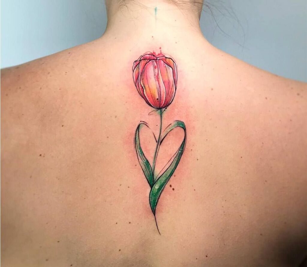 Color tattoo of a tulip on the back for women