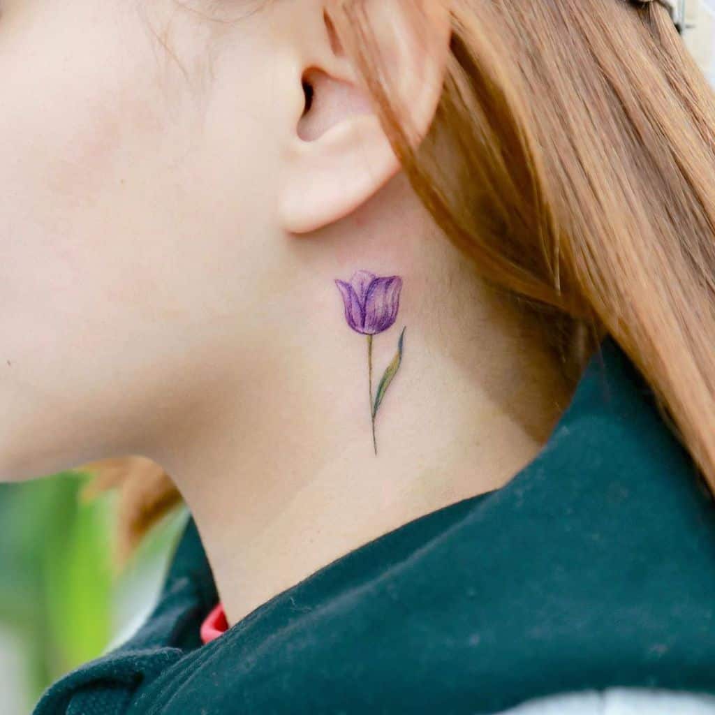 Color tattoo of a tulip on the neck for women