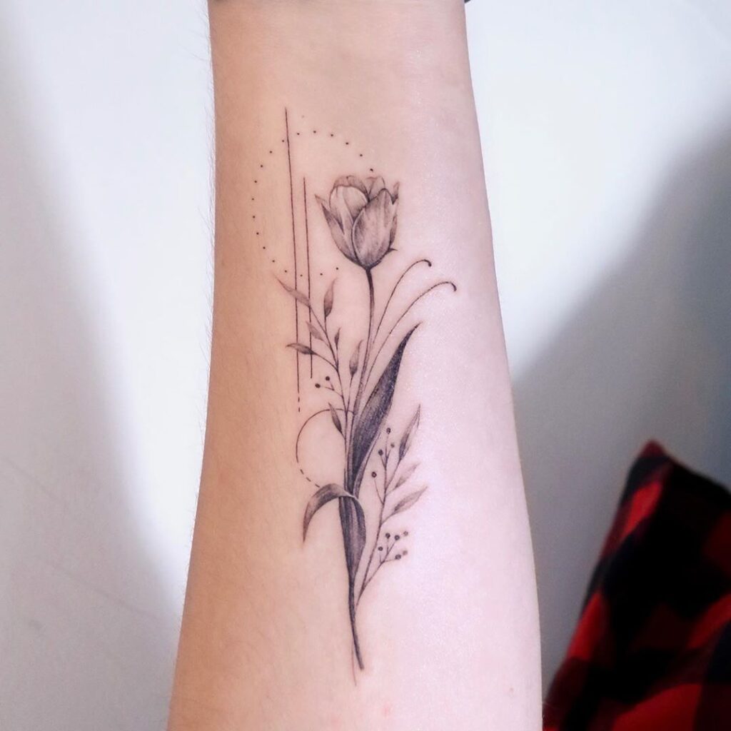 Tulip tattoo on the forearm for women