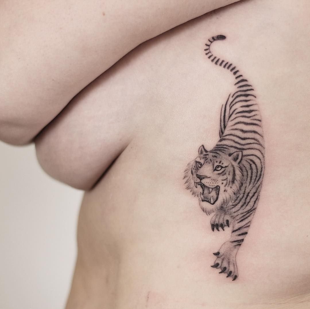 Tiger tattoo on the side for women