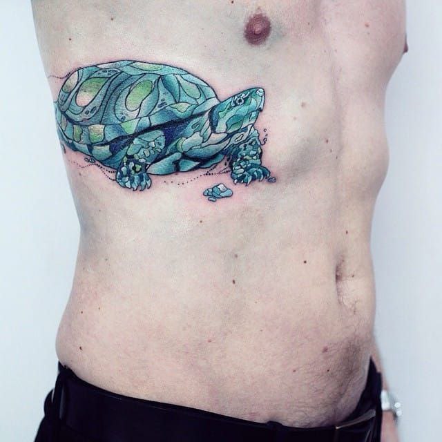 Tattoo of a colored turtle on the side for men