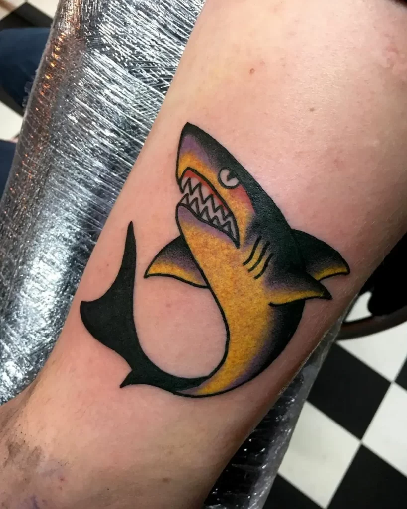 Colorful shark tattoo on the leg for men