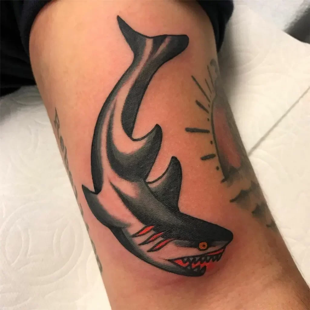 Colorful shark tattoo on the shoulder for men