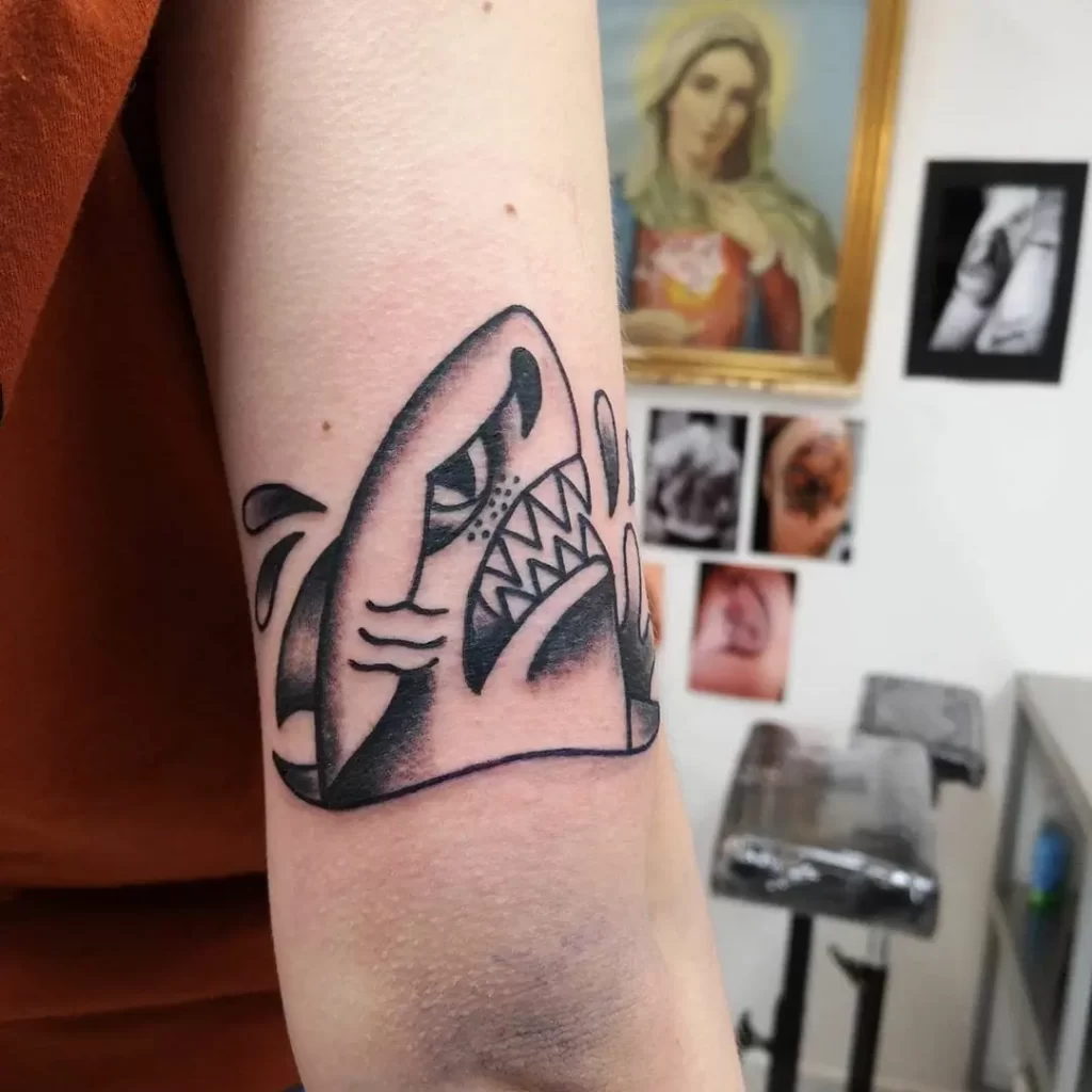 Shark tattoo on the shoulder for women