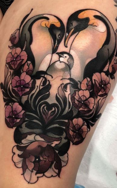 Penguin tattoo on the thigh for women