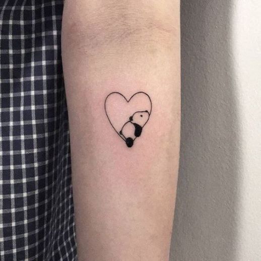 Bear and heart tattoo on forearm for women