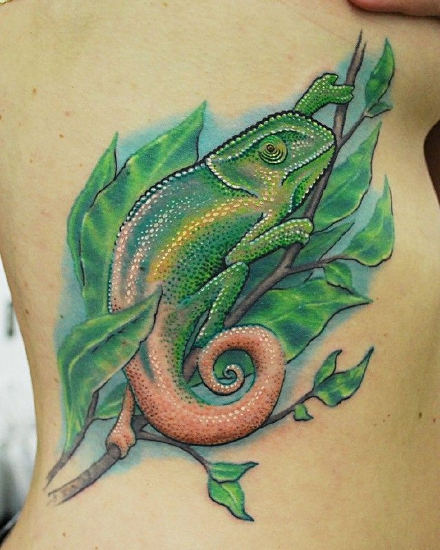 Tattoo of a colored chameleon on the side for women