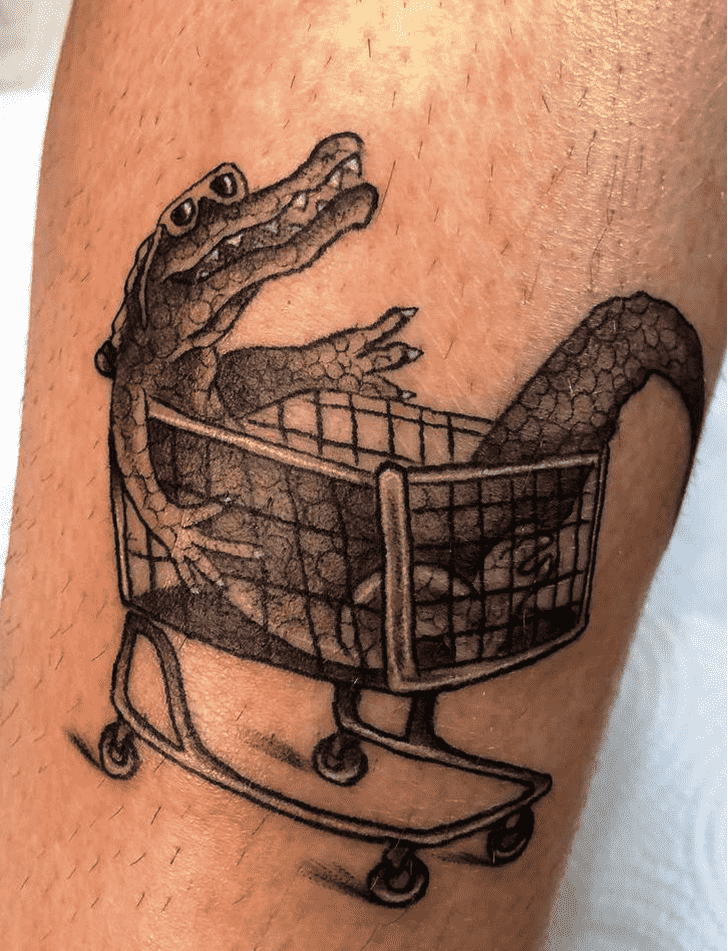 Tattoo of a crocodile on the leg for men