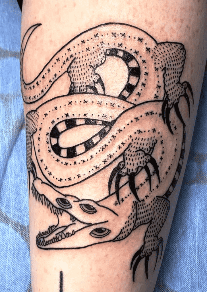 Crocodile tattoo on the leg for women