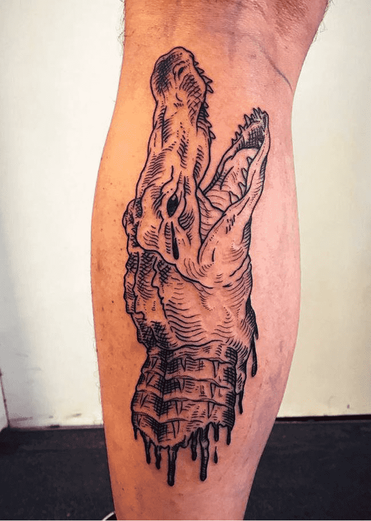 Crocodile tattoo on the shin for men