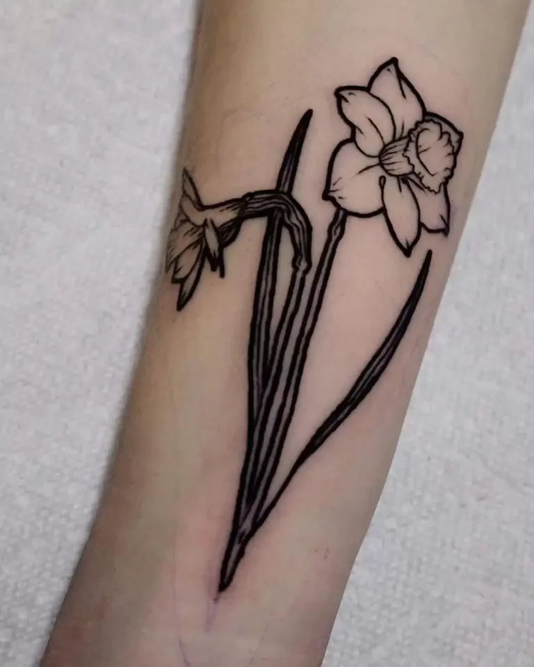 Daffodil flower tattoo on the arm for women