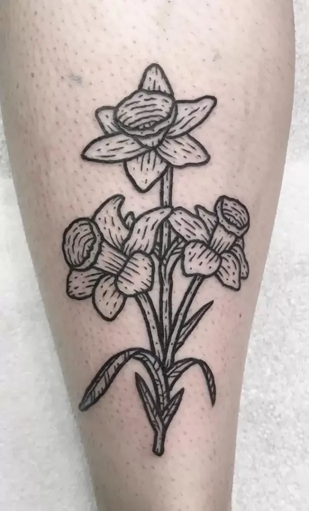 Daffodil flower tattoo on the calf for men