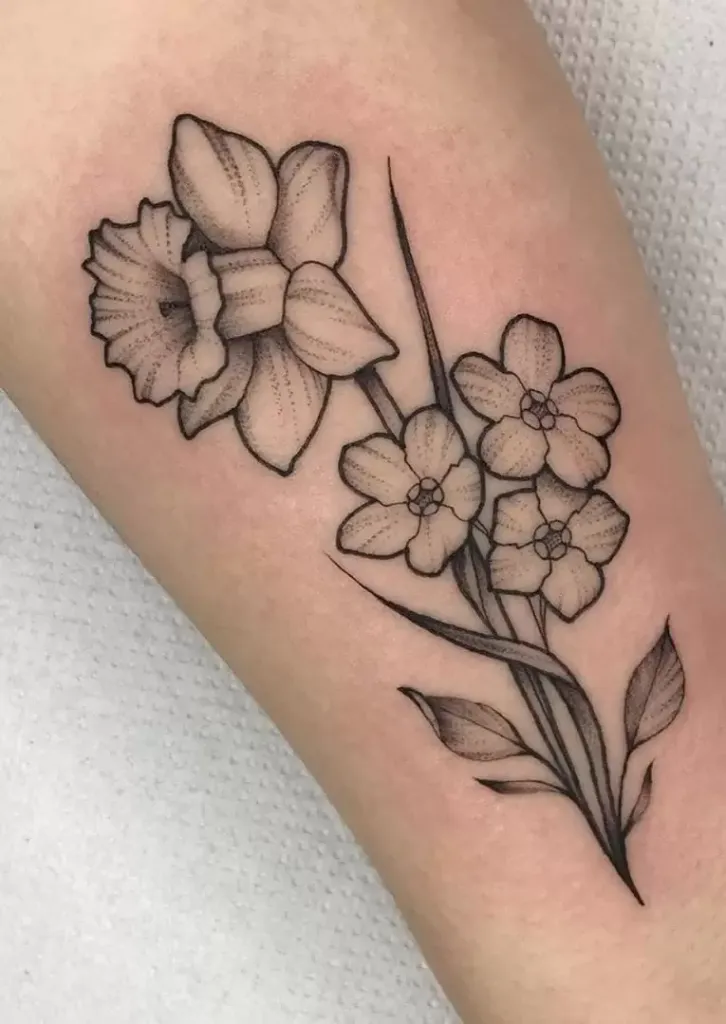 Daffodil flower tattoo on the forearm for women