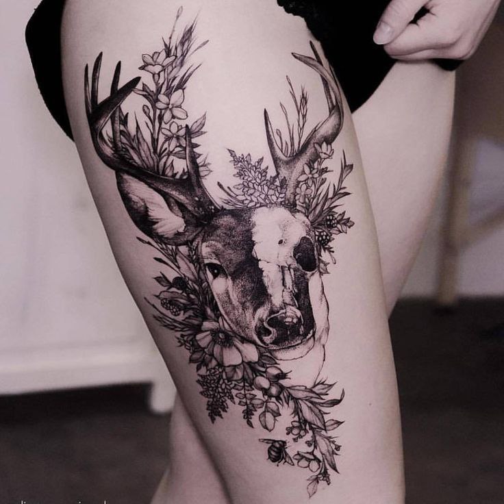 Tattoo of a deer on the hip for women