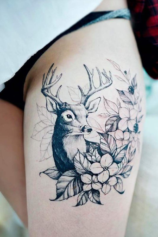 Tattoo of a deer and flowers on the hip for women