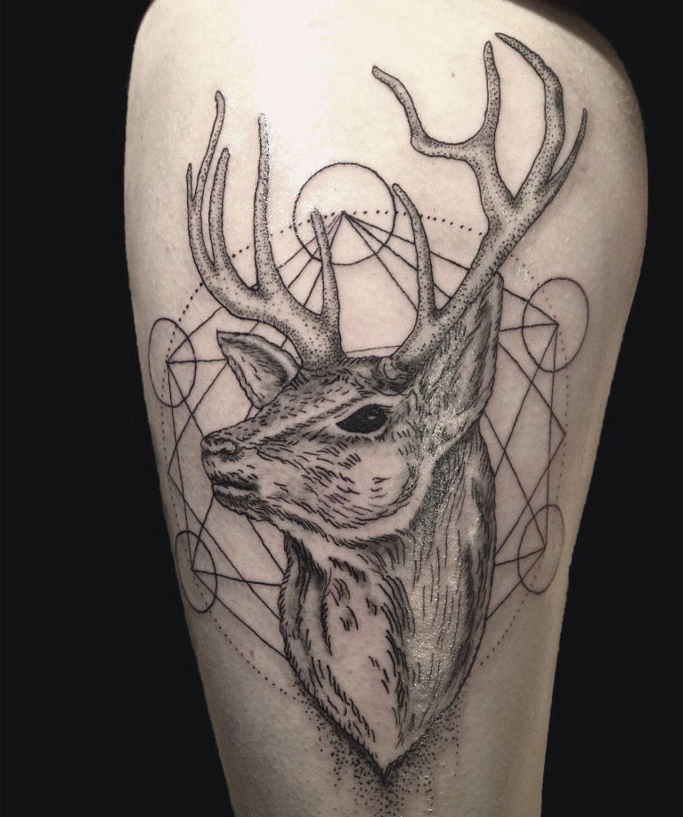 Tattoo of a deer on the hip for women