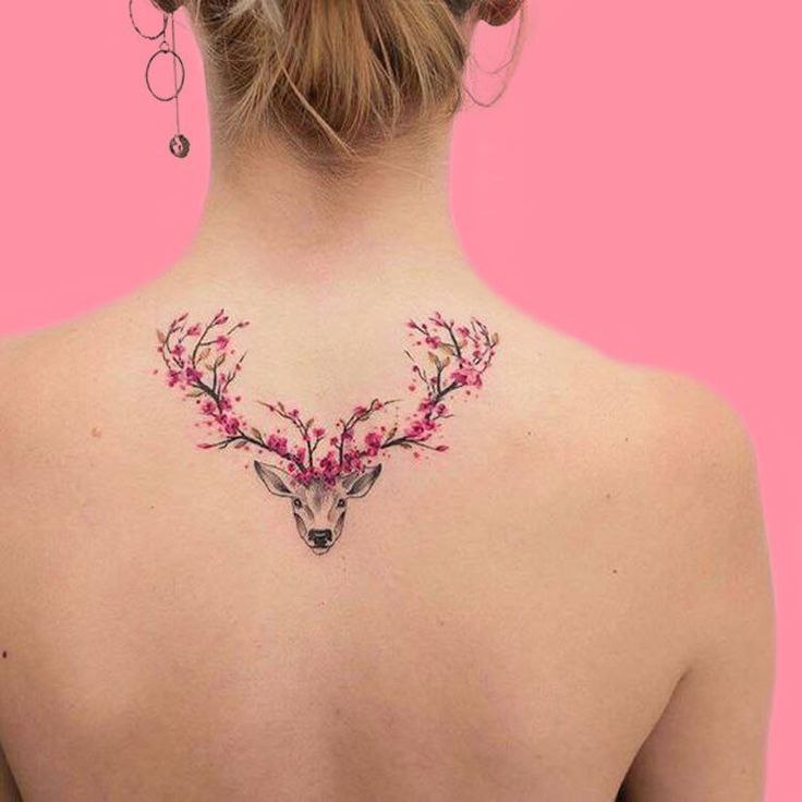 Tattoo of a deer on the back for women