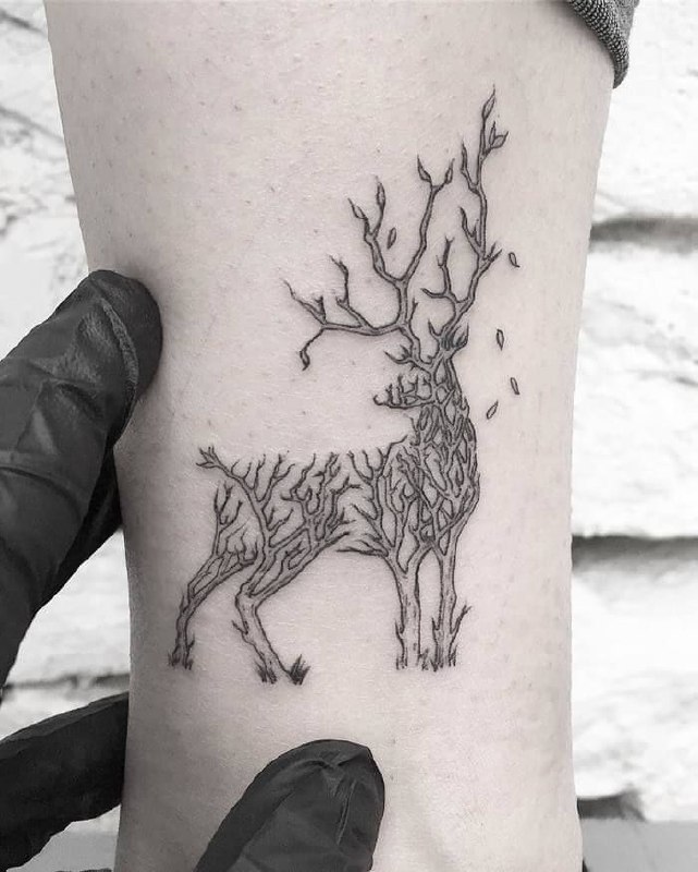 Tattoo of a deer on the shin for women