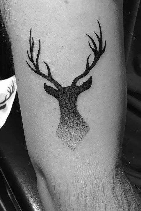 Tattoo of a deer on the hip for men