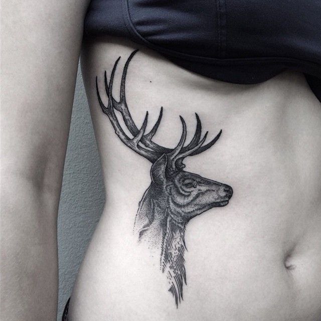 Tattoo of a deer on the side for women