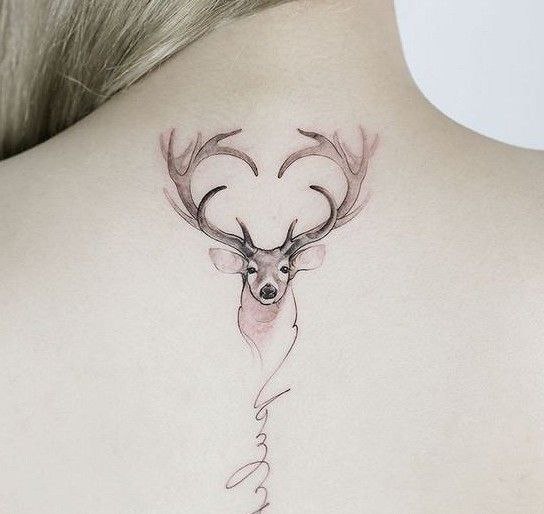 Tattoo of a deer on the back for women