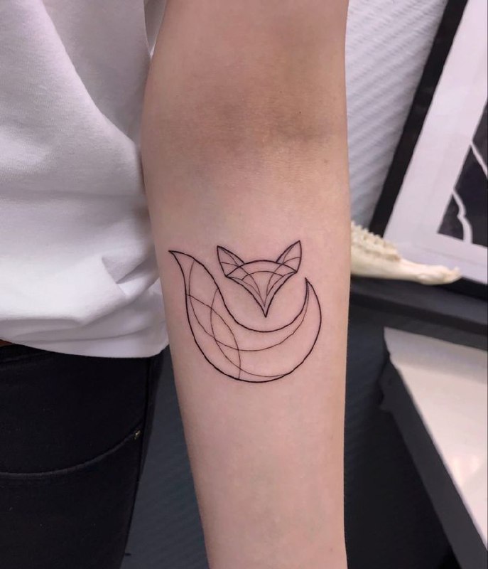 Fox tattoo on the forearm for women