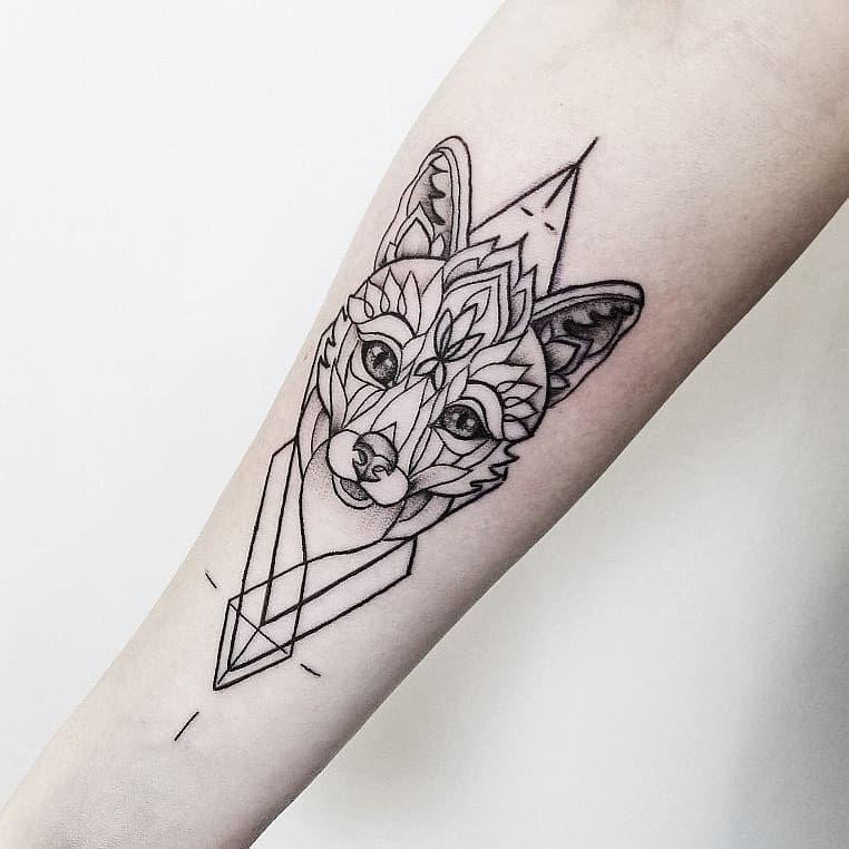 Fox tattoo on the forearm for women