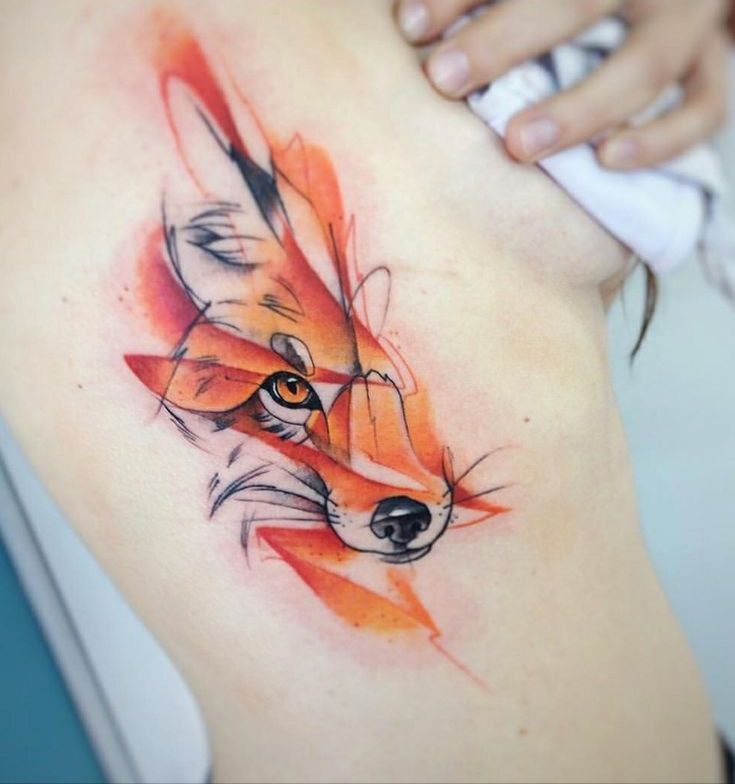 Tattoo of a colored fox on the side for women