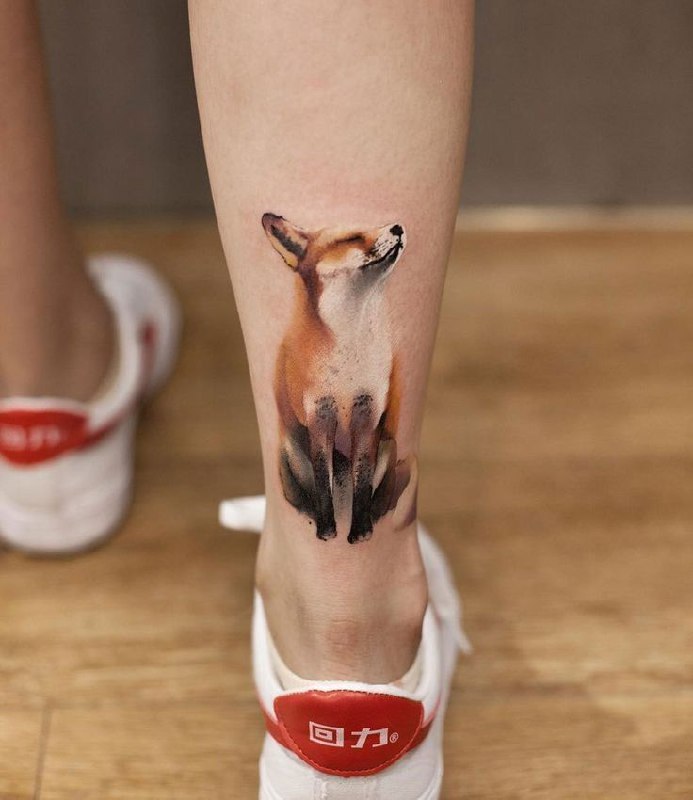 Fox tattoo on the calf for women