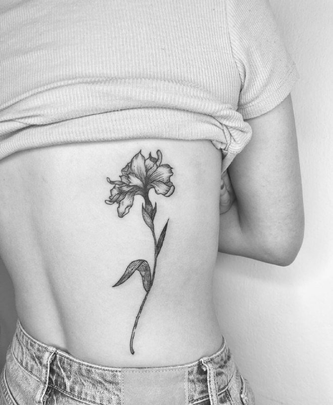 Iris tattoo on the back for women